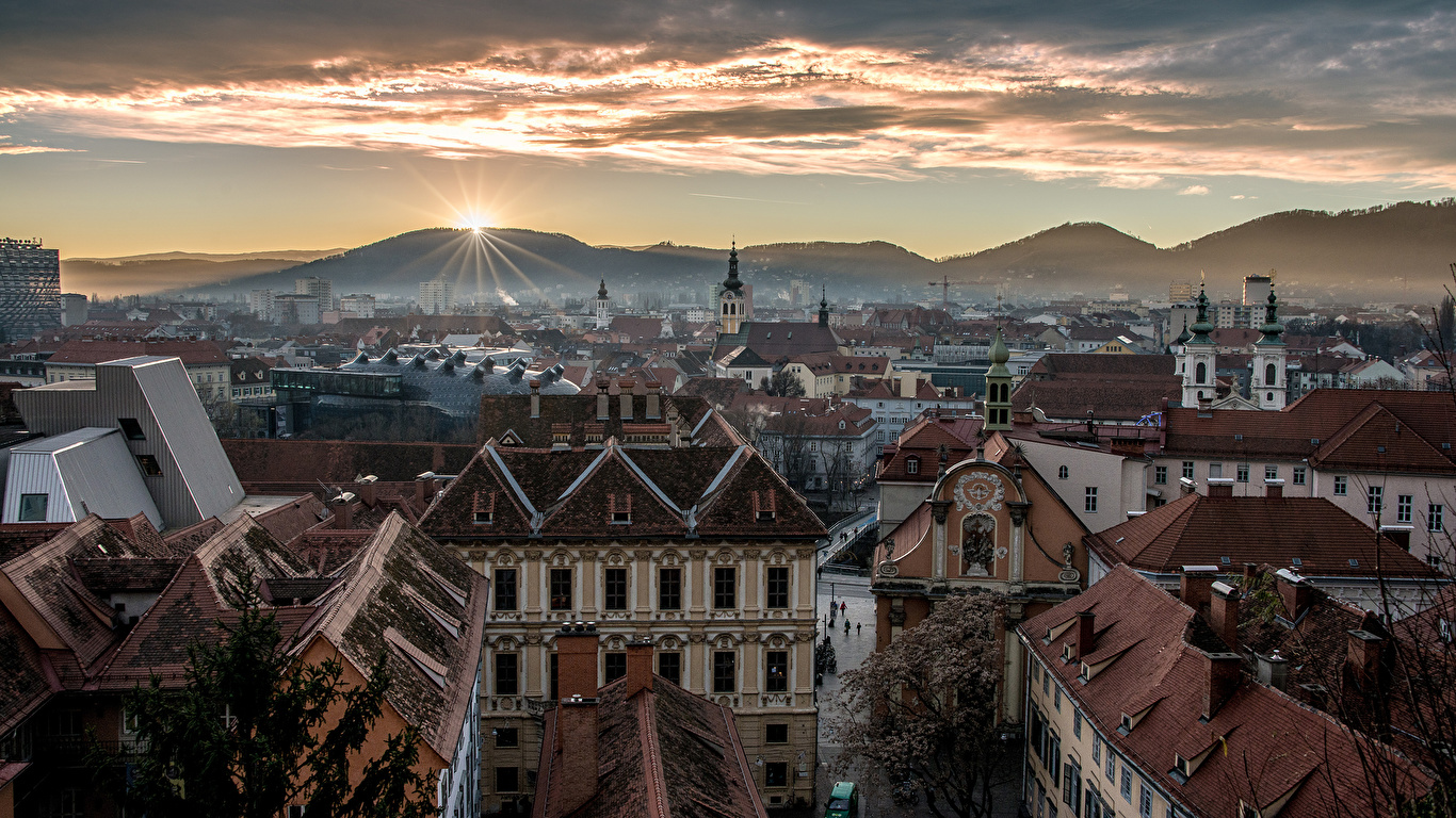 Картинка Австрия Graz Горы Рассветы и закаты Дома город 1366x768 гора рассвет и закат Здания Города
