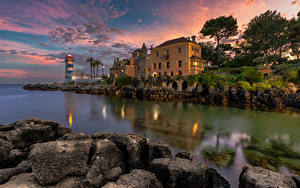 Фото Португалия Здания Маяк Вечер Камни Залива Cascais