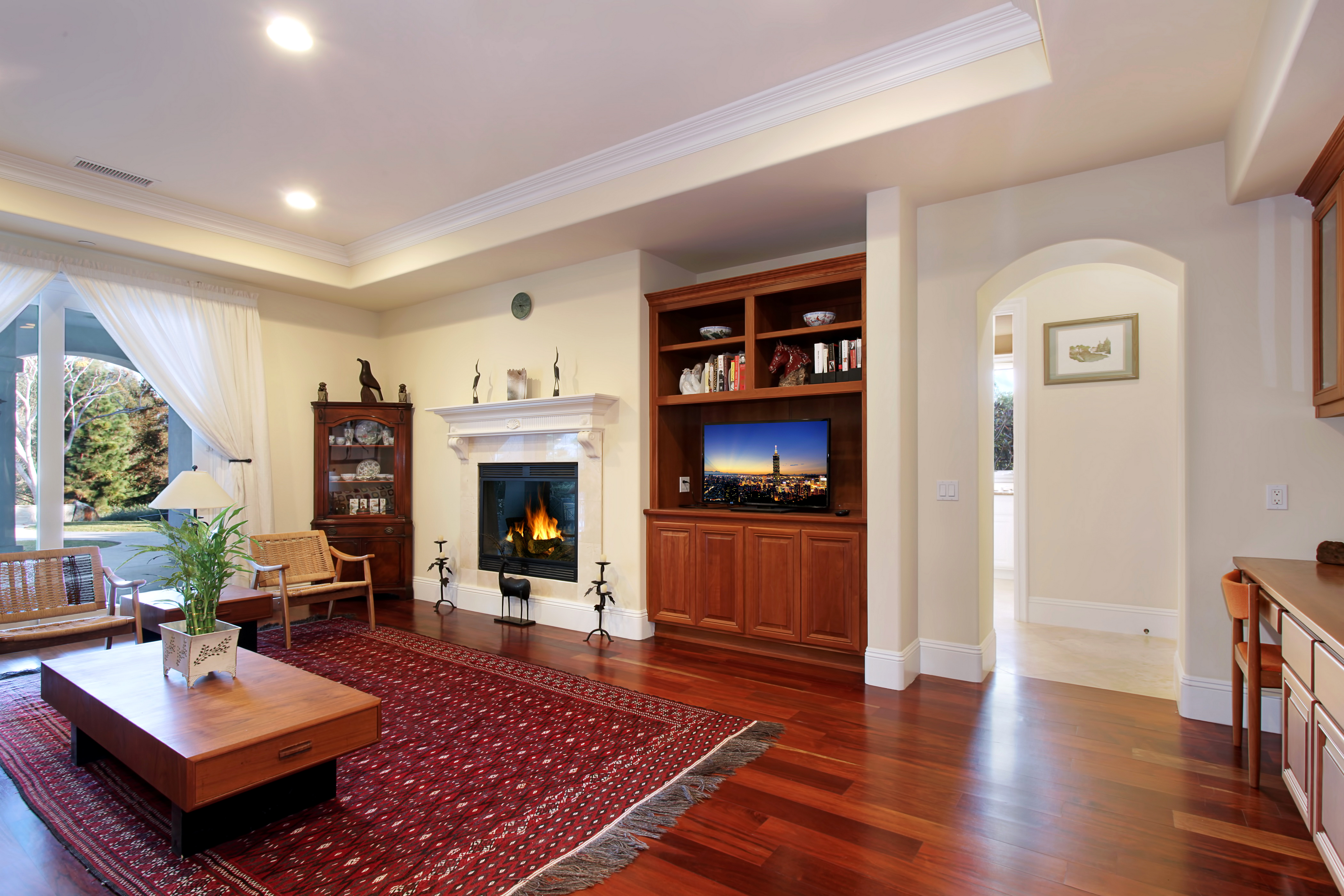 fireplace between 2 rooms of carpet