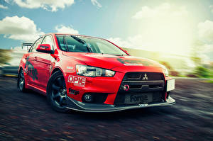 Фотографии Mitsubishi Красная Lancer Evolution X Автомобили