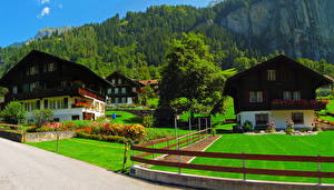 Картинки Швейцария Дома Газон Забор Lauterbrunnen Города