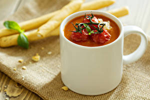 Фотография Супы Кружка Tomato soup in a Cup of baked tomatoes on top First course Еда