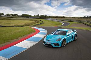 Фотографии Порше Голубая 718 (982) Cayman GT4 автомобиль