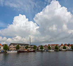 Фотографии Голландия Здания Реки Причалы Облака Haarlem Города